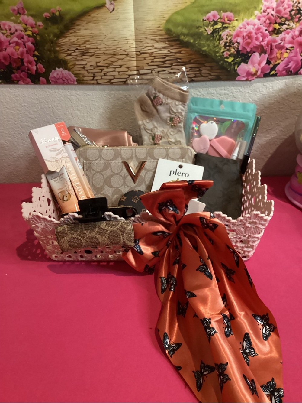 Beige Signature Canvas Wristlet with Orange Butterfly Bow